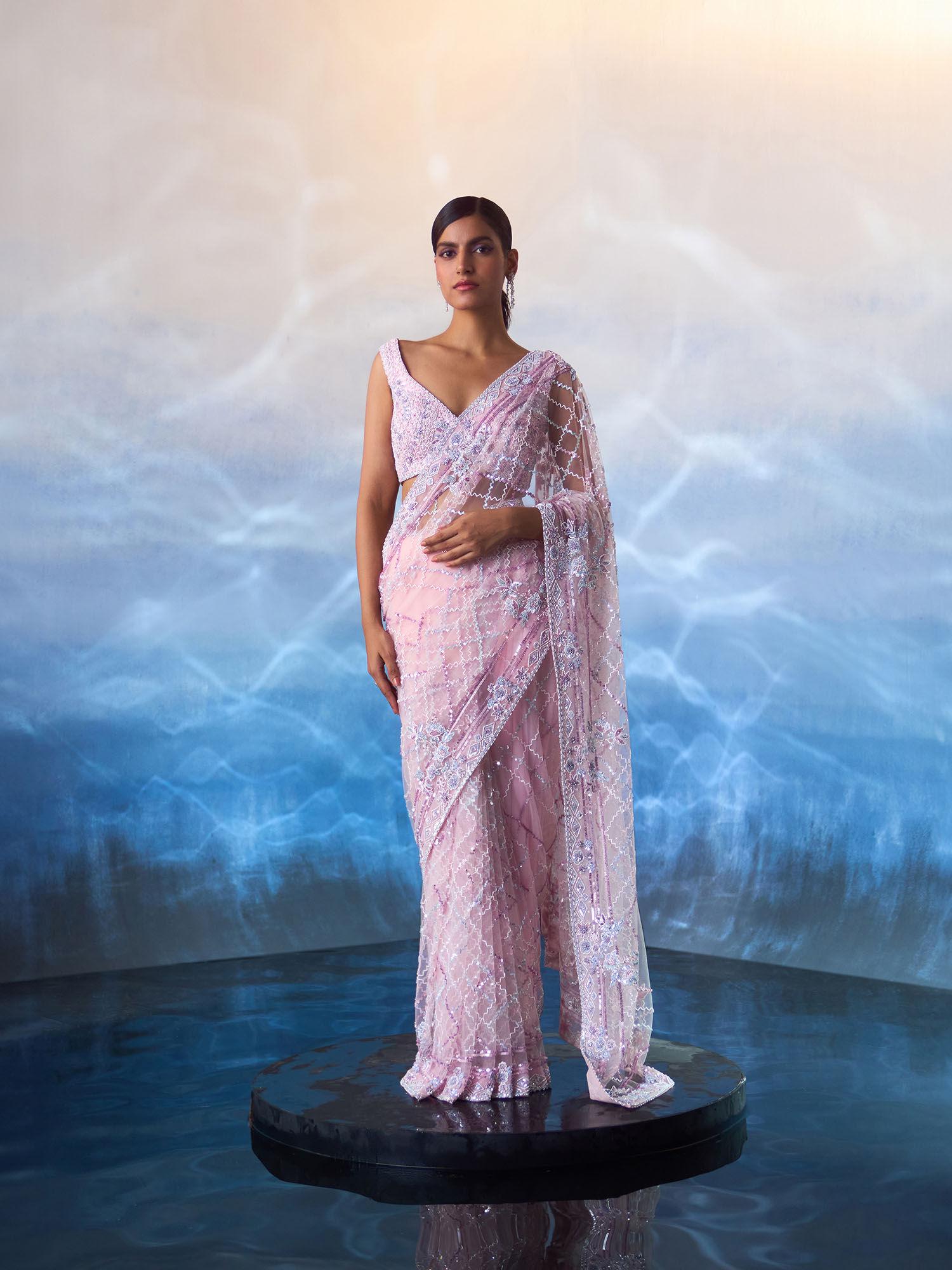 blush pink net saree with stitched blouse and petticoat