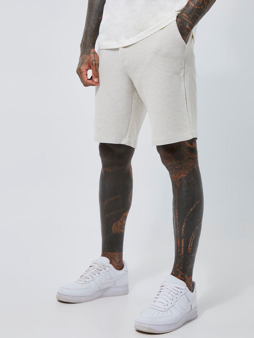 boohooman loose fit mid rise waffle textured shorts