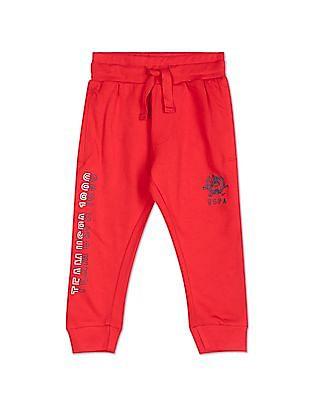 boys red mid rise brand print joggers