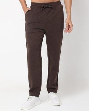 brand embossed regular fit pants