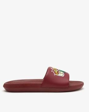 brand print slides with textured footbed
