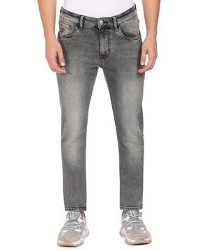 brandon mid-wash slim tapered fit jeans