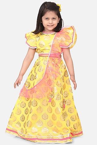 bright yellow dupion silk ruffled lehenga set for girls