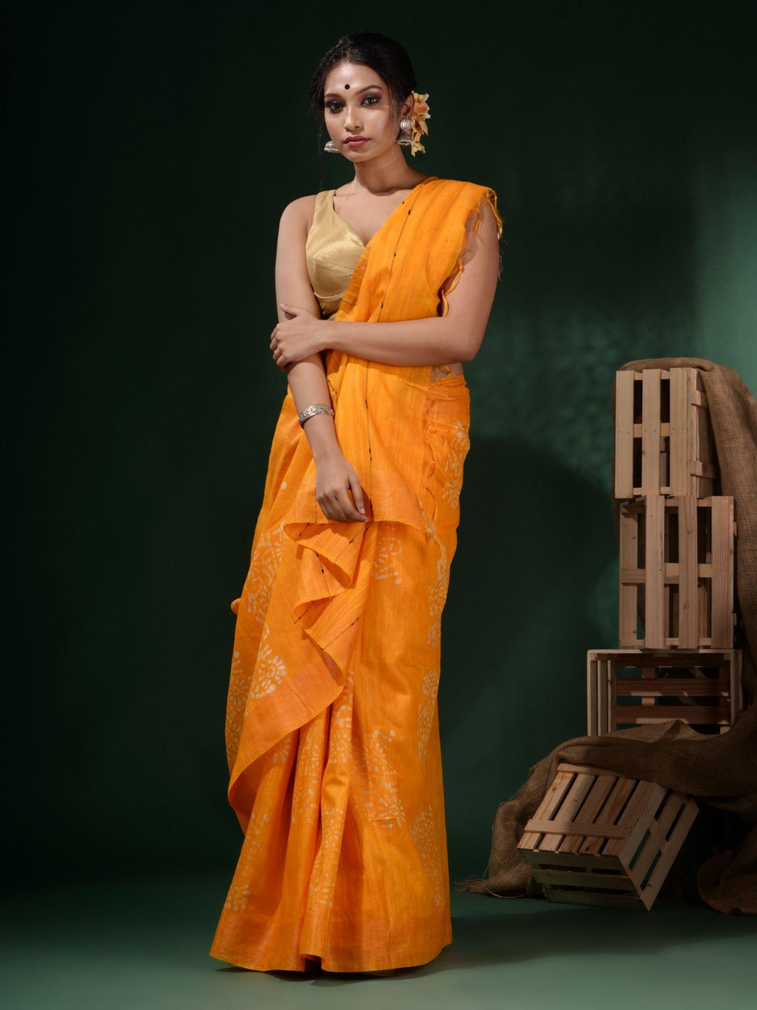 bright yellow silk blend batik print saree with unstitched blouse