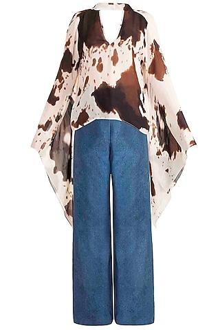 brown printed top with flared denim pants