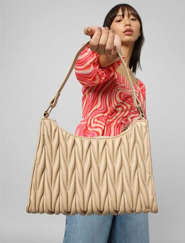 brown quilted bag