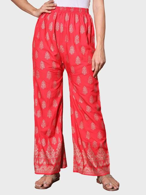 buynewtrend red printed palazzos
