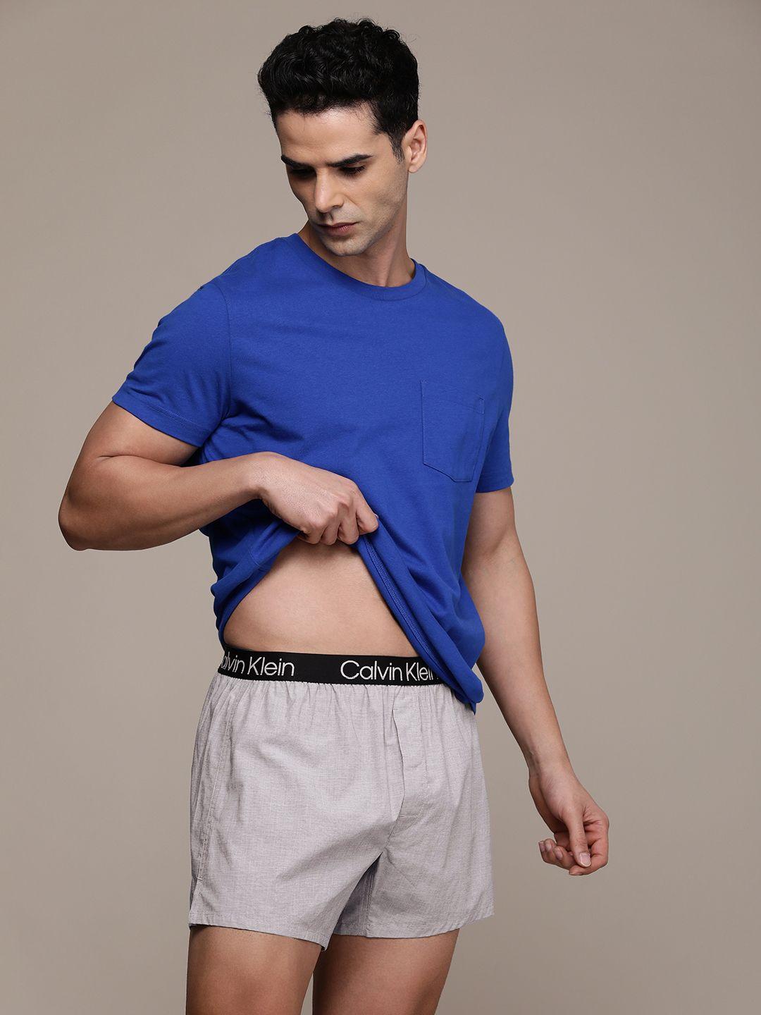 calvin klein underwear men solid with brand logo waistband boxers nb3012ub1