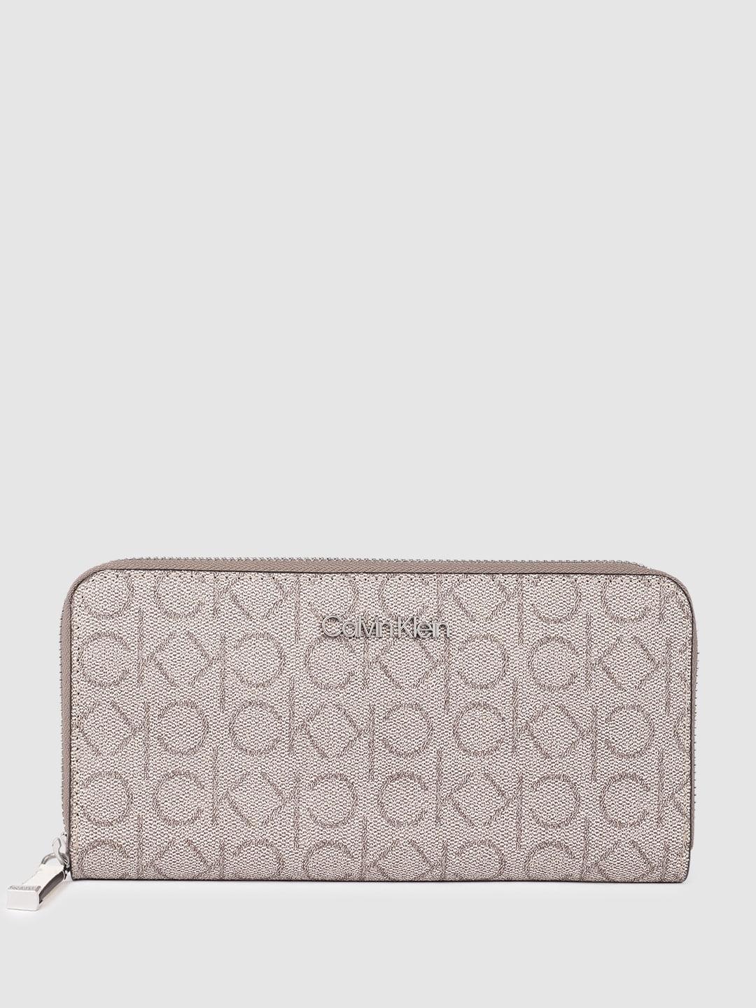 calvin klein women brand logo print & textured zip around wallet