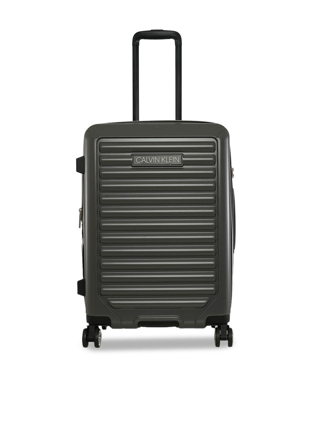 calvin klein  odyssey range textured hard-sided medium trolley suitcases