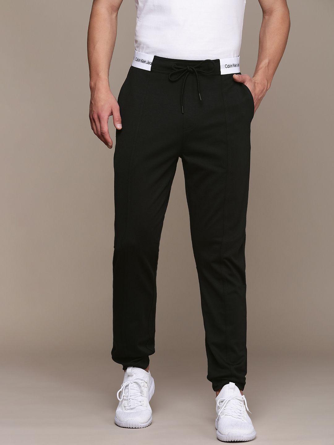 calvin klein jeans men black solid track pants