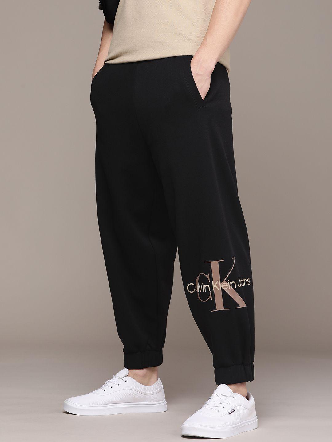 calvin klein jeans men brand logo printed relaxed fit joggers with drawstring closure