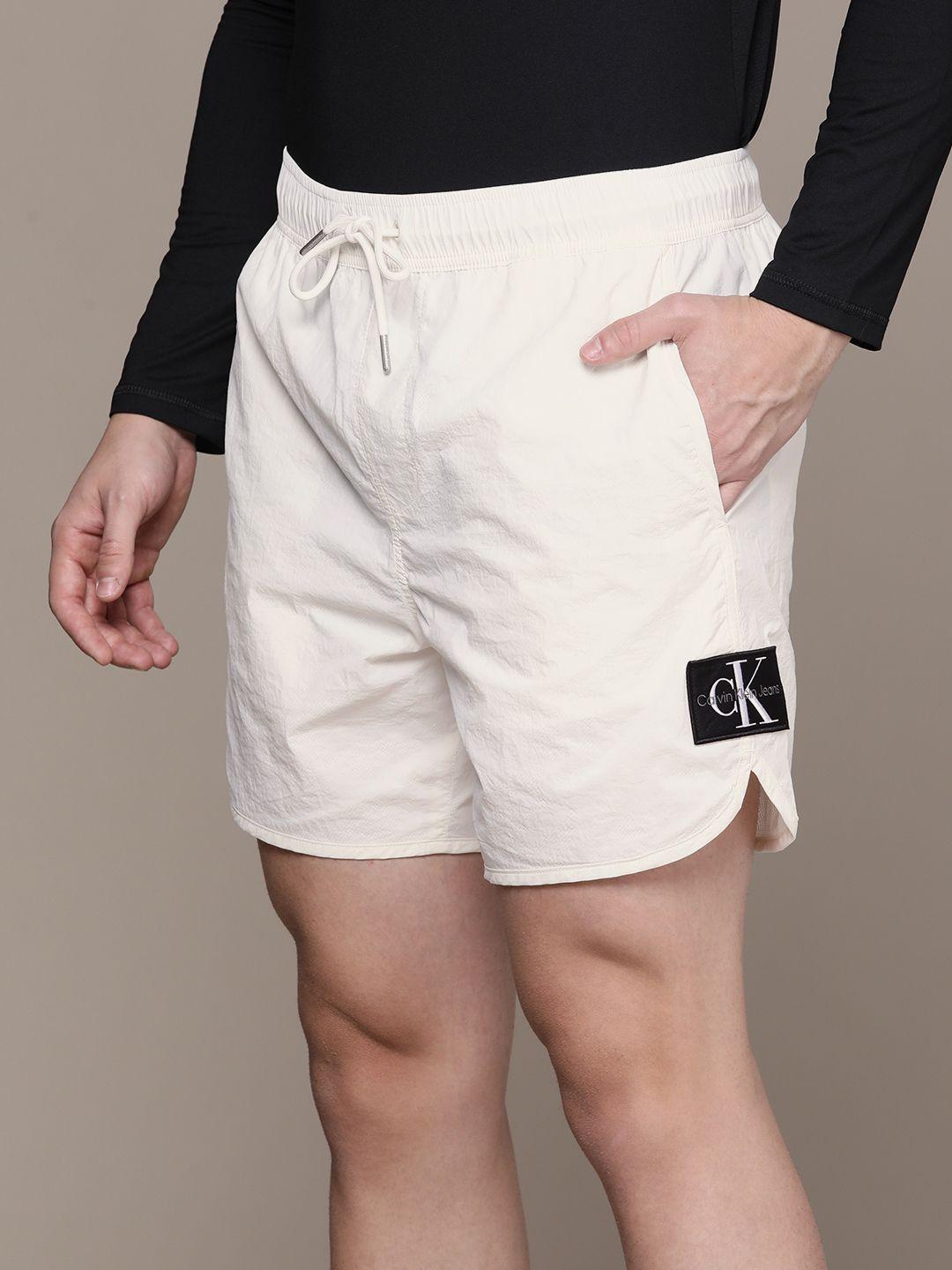 calvin klein jeans men solid mid-rise regular shorts with attached mesh lining