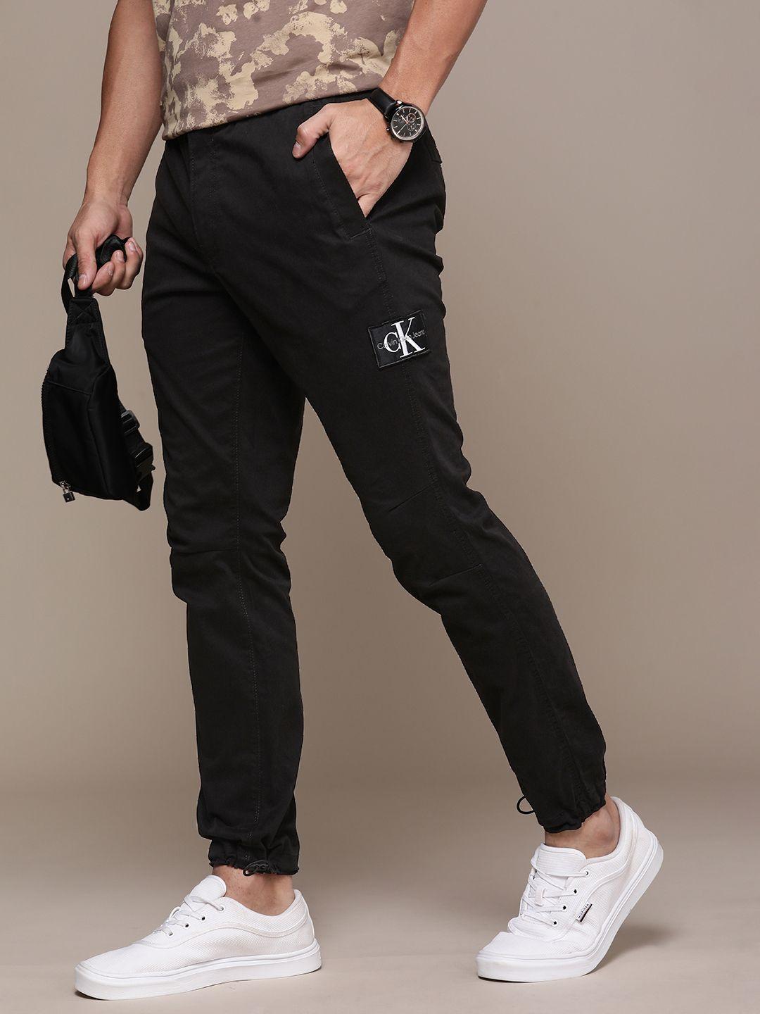 calvin klein jeans men solid mid-rise regular trousers