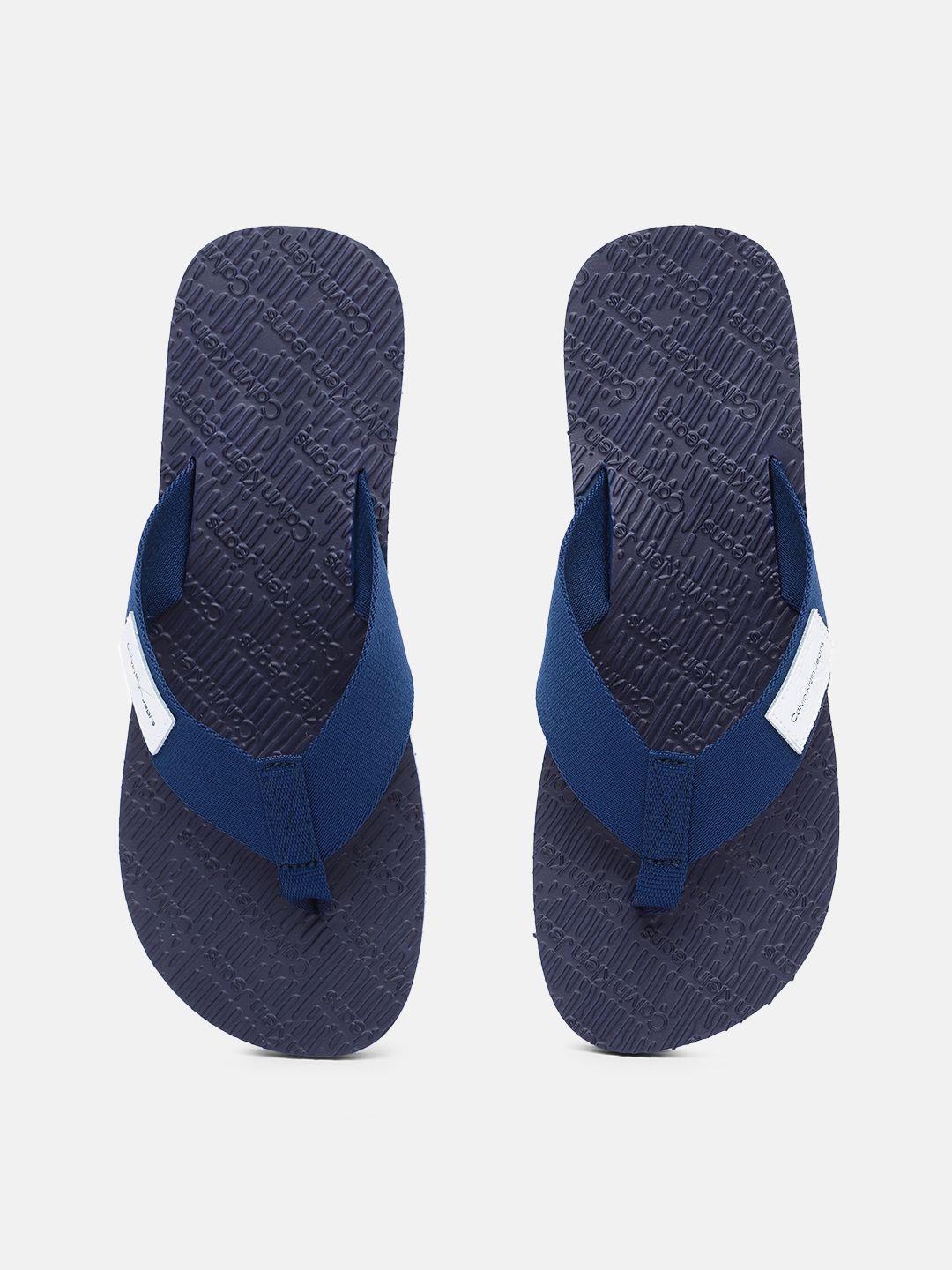 calvin klein jeans men solid thong flip-flops with brand logo applique detail