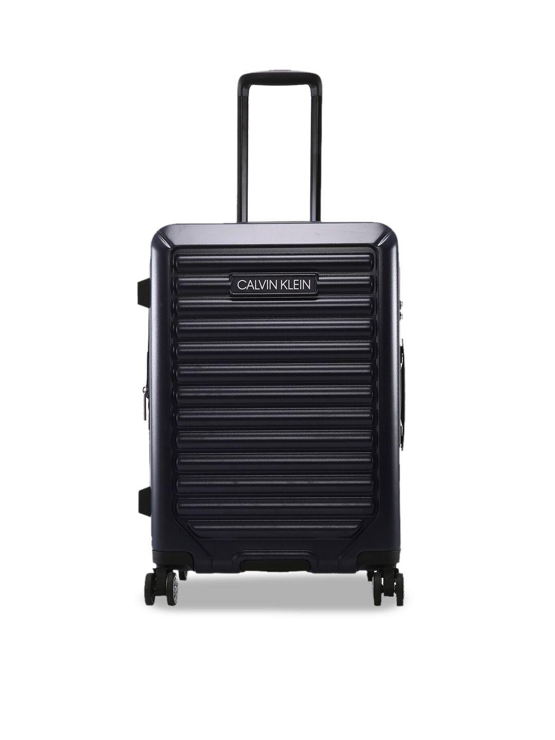 calvin klein odyssey hard-sided 360-degree rotation medium trolley suitcase