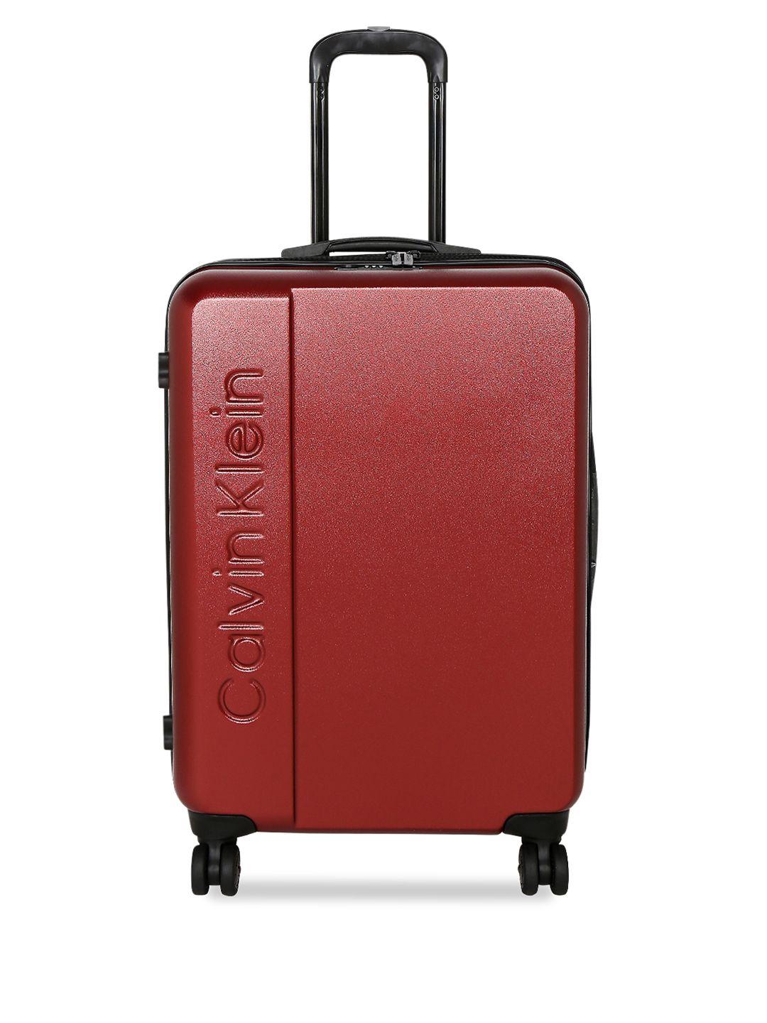 calvin klein red solid manhattan hard-sided medium trolley suitcase