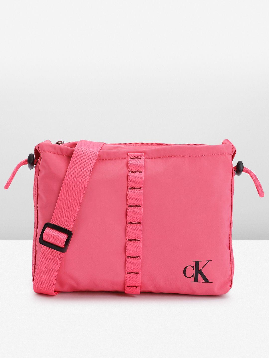 calvin klein solid structured sling bag with cinched applique detail & toggle