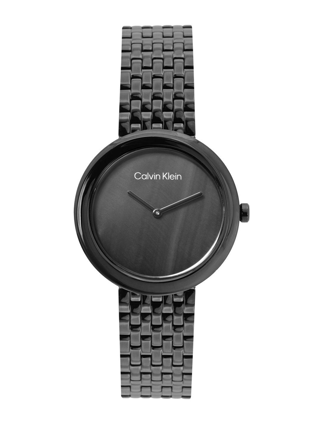 calvin klein women twisted bezel mother of pearl bracelet style analogue watch 25200323