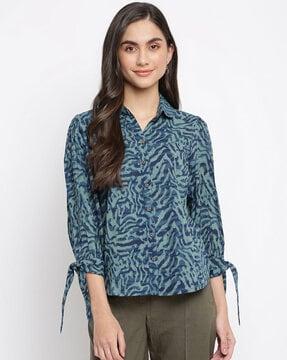 camoflauge print buttoned-down top