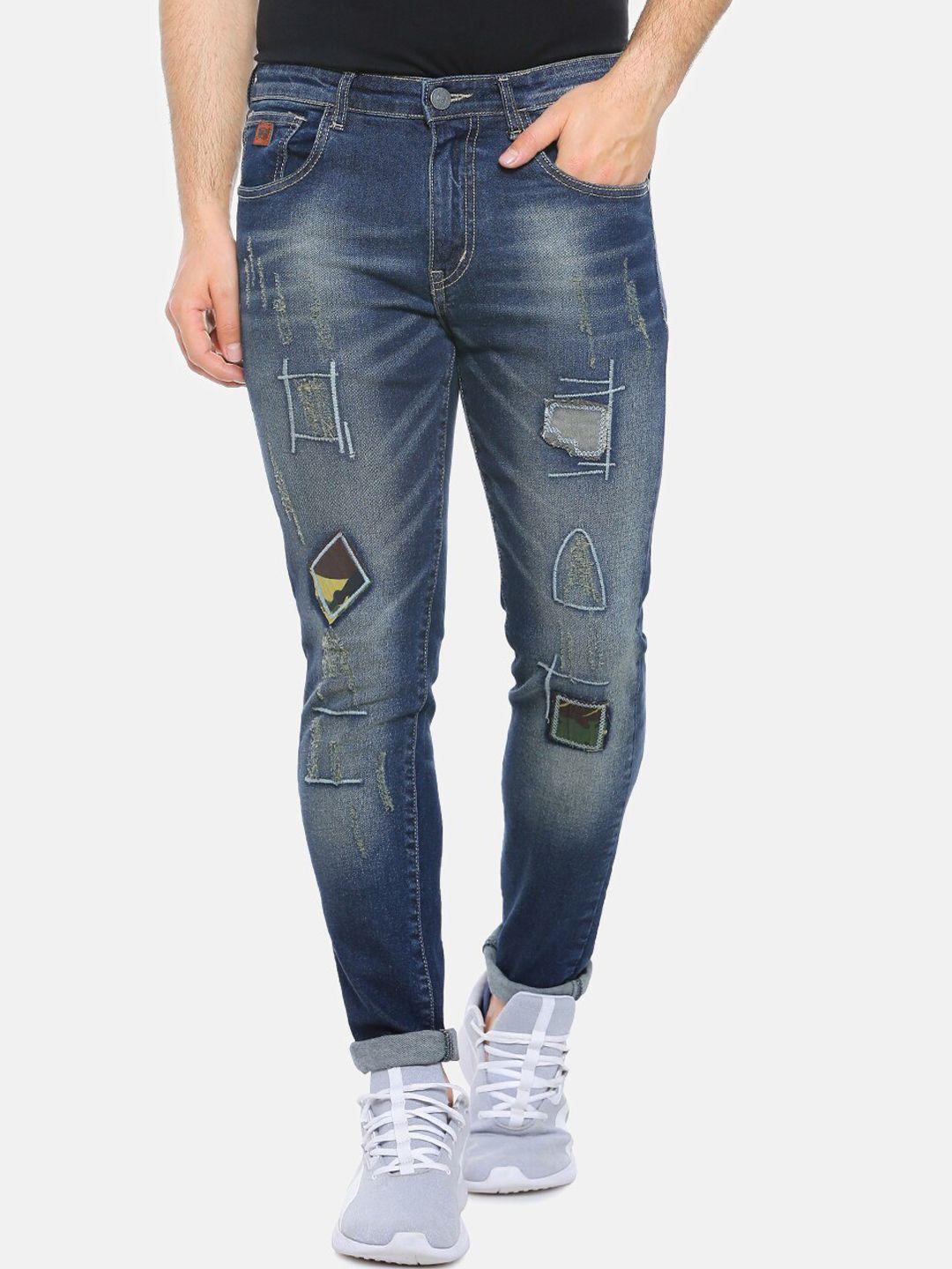 campus sutra men blue smart slim fit heavy fade mildly distressed stretchable cotton jeans
