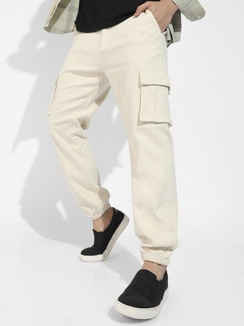 campus sutra pale yellow cotton regular fit cargos