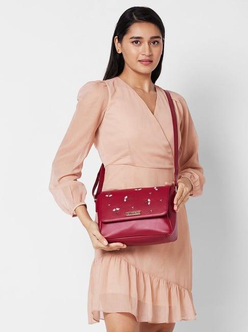 caprese dara maroon faux leather embroidered sling handbag