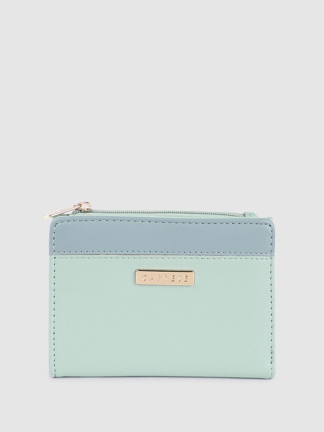 caprese women solid two fold wallet with minimal colourblocked detail