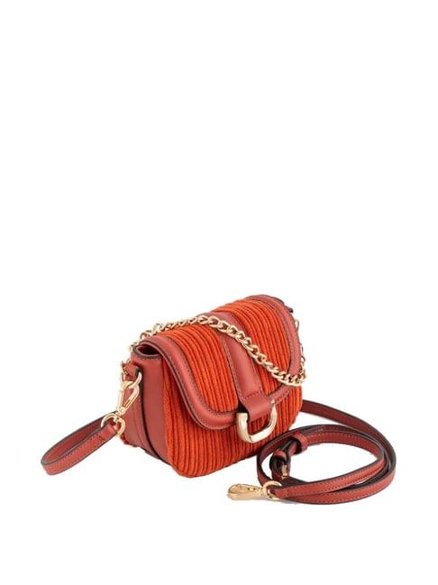 carpisa rust textured mini sling handbag