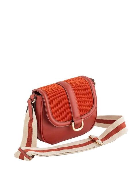 carpisa rust textured small sling handbag