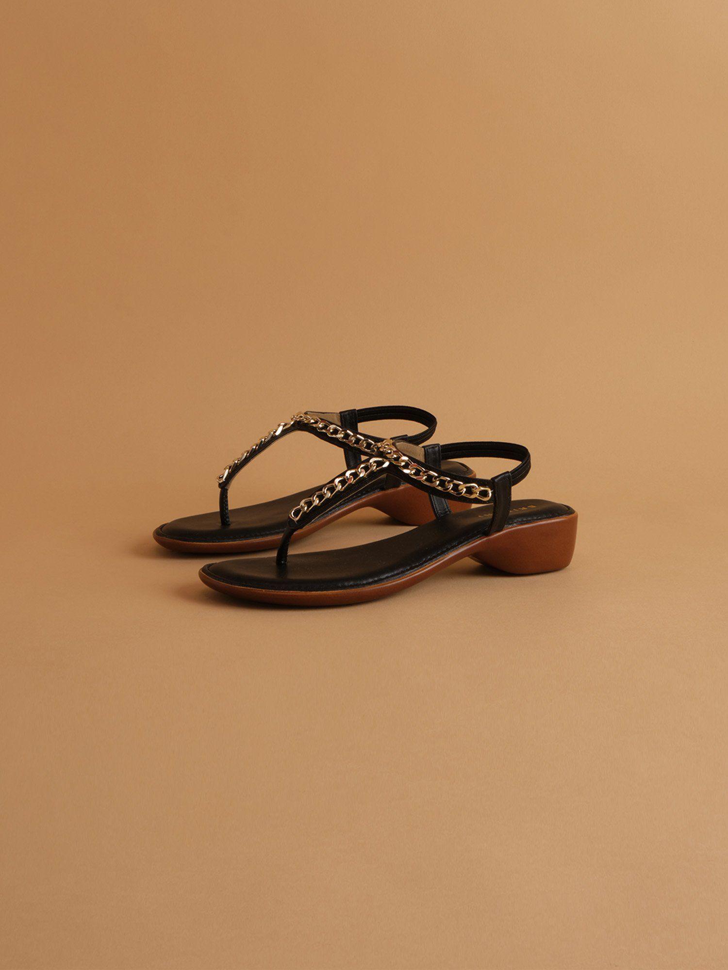 chained black aveda flats