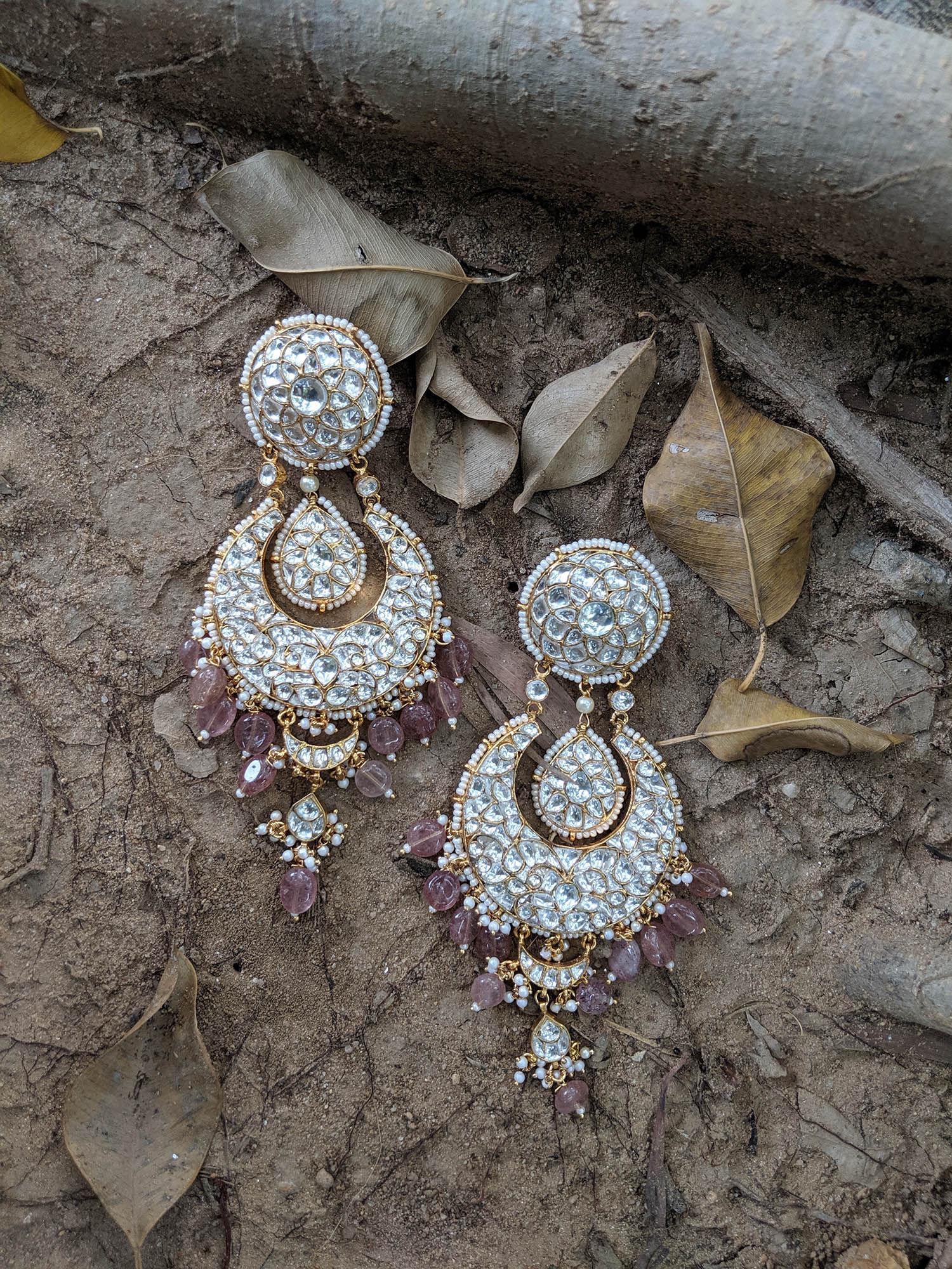 chand earrings with white jadtar stones and light pink beads and attached ear chains