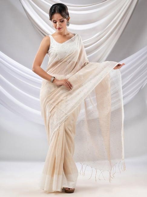 charukriti beige embellished saree with unstitched blouse