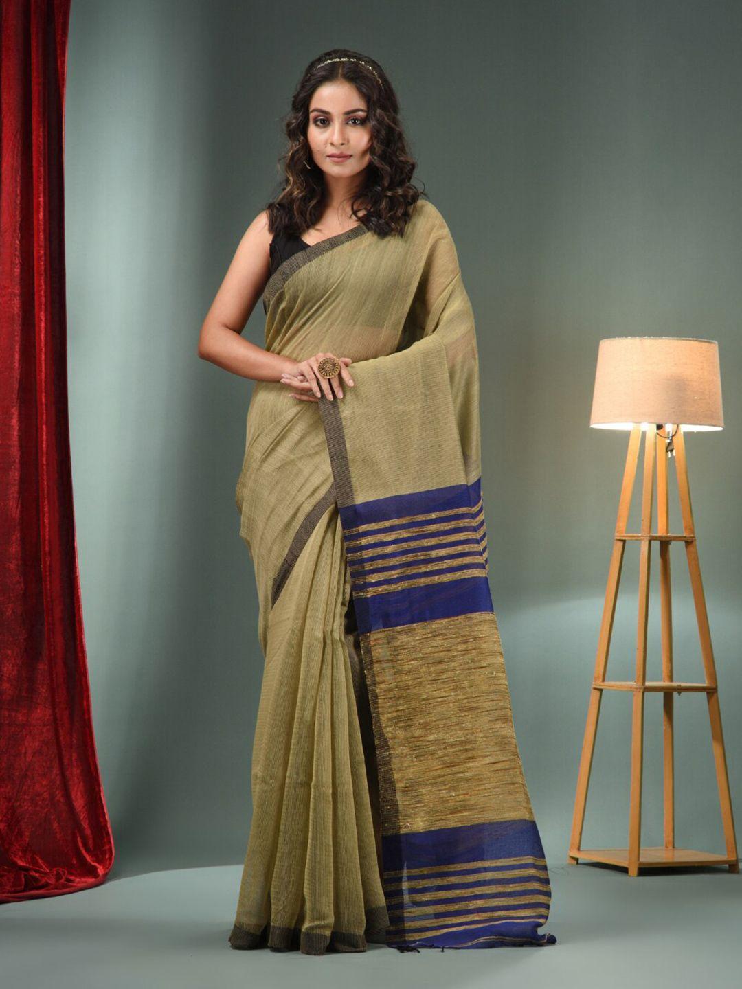 charukriti beige navy blue striped saree