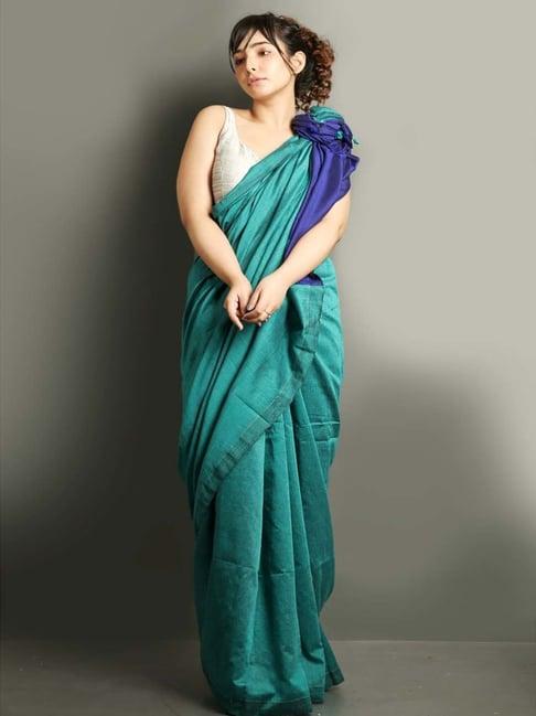 charukriti teal blue cotton saree with unstitched blouse