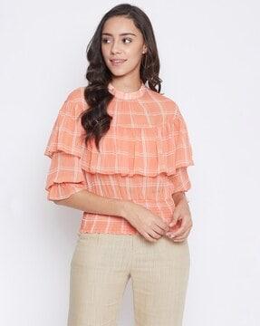 checked high-neck ruffled top