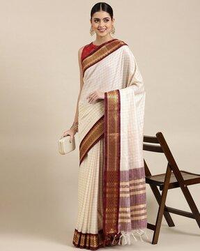 checked saree with contrast border and tassels