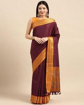 checked saree with contrast border and tassels