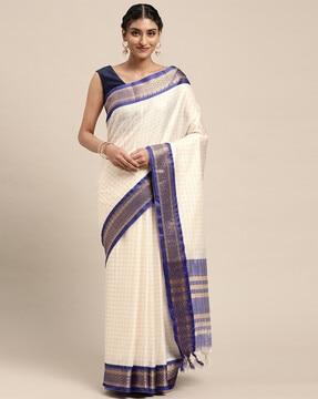 checked saree with contrast border and tassels