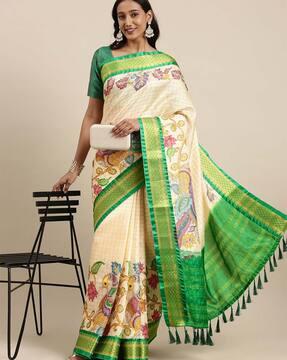 checked saree with contrast border and tassels