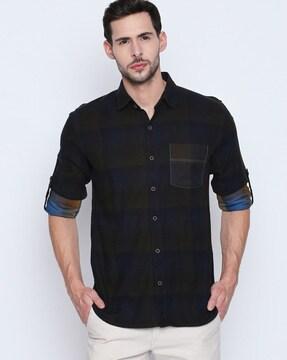 checked shirt with roll-up sleeves