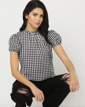 checked top with cuffed sleeves