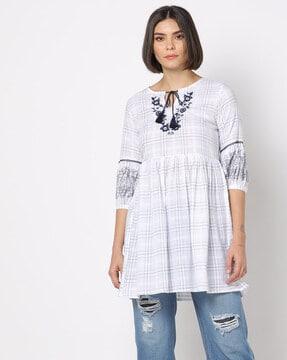 checked tunic with floral embroidery