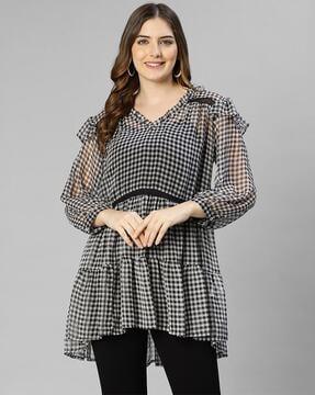 checked tunic with ruffled accent