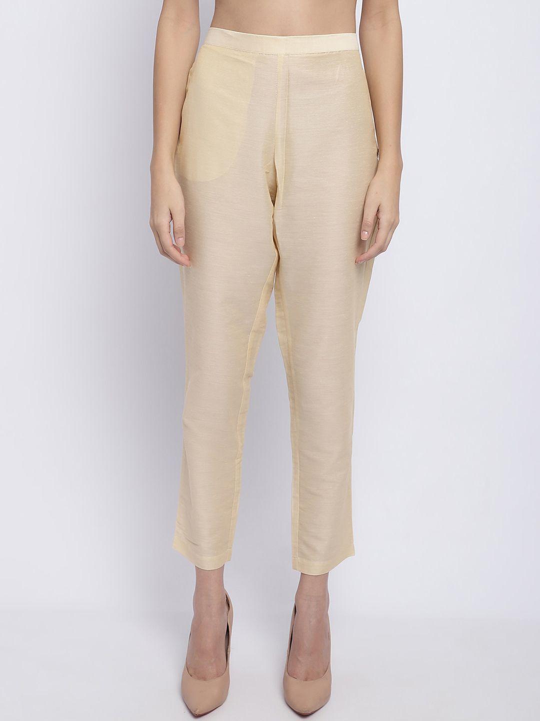 chique women gold-toned trousers