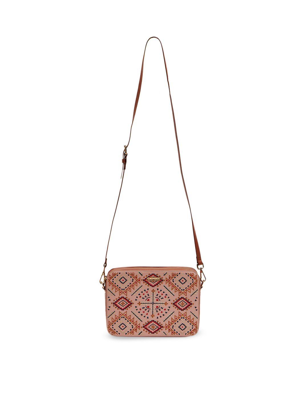 chumbak peach-coloured pu structured sling bag with cut work