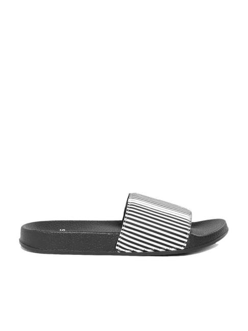 cl sport by carlton london women's black & white slides