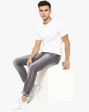 clean distress jeans with striped detail