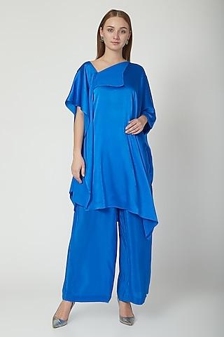 cobalt blue off-shoulder top with trousers