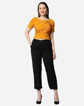 cold-shoulder top with trousers
